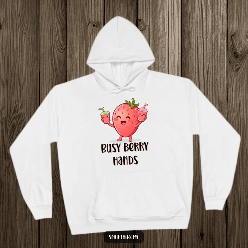 Funny Strawberry character cheerfully juggling tiny smiling smoothie cups, featured on a cozy hoodie.