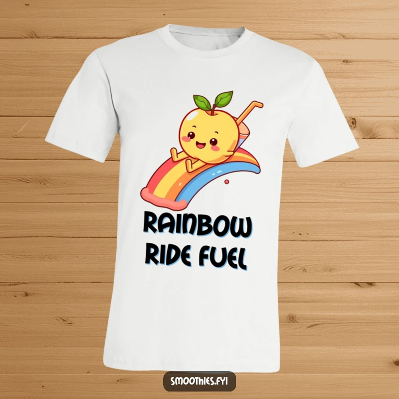 Funny smiling apple character sliding down a rainbow into a smoothie, featured on a fun t-shirt.